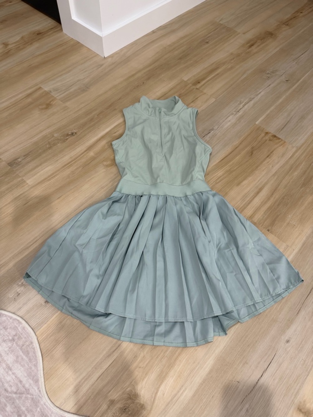 Sleeveless Mint Green Fit-and-Flare Dress with Pleated Skirt